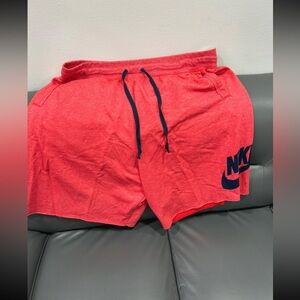 Nike Men's Athletic Red Shorts with Navy Nike swoosh Accents